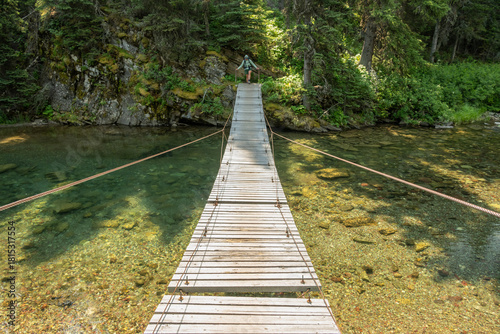 Backpacker Begins To Cross The Foot Of Elizabeth Lake Suspension Bridge