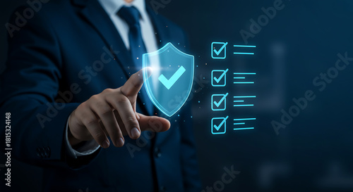 Businessman touches glowing digital shield with checkmark, symbolizing robust cybersecurity, data protection, and trust