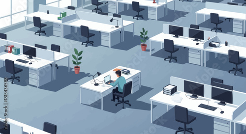 Man working alone at desk in office environment.