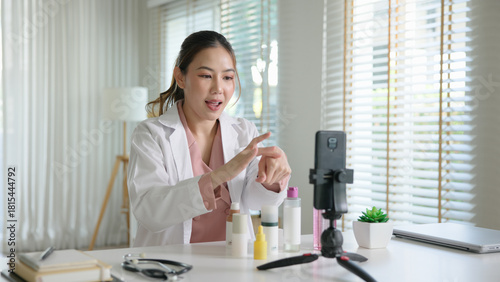 Asia woman people anti aging expert modern health vlogger live advice talk selfie video mobile phone camera. Online digital seller asian small SME store shop owner side hustle filming sell skin care.