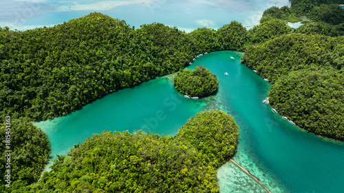 Wallpaper Mural Aerial view of lagoon with small forest islands and boats floating on calm water. Siargao, Philippines. Sugba Blue Lagoon. Torontodigital.ca