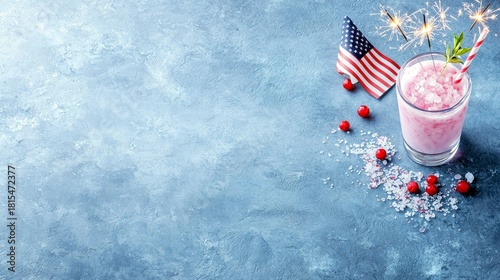 A festive pink slushy drink is garnished with an American flag, sparklers, and cranberries, perfect for a holiday celebration.