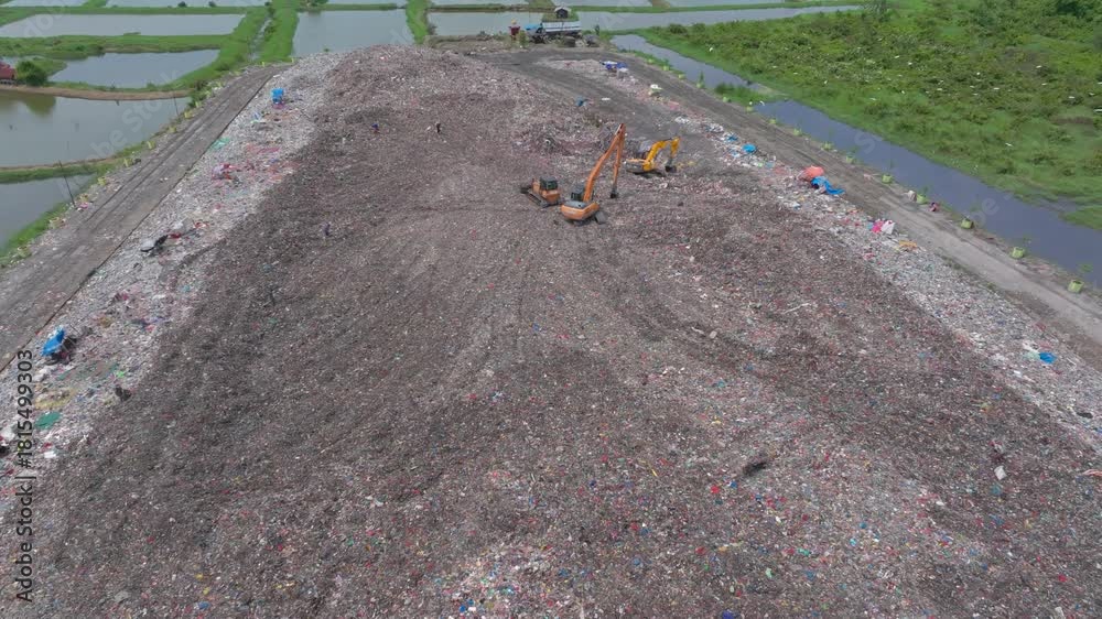 custom made wallpaper toronto digital Aerial footage of a landfill in Medan, showcasing heavy machinery managing and organizing waste efficiently