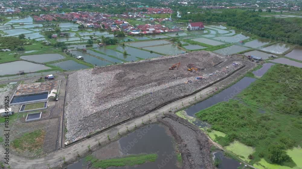 custom made wallpaper toronto digital Aerial footage of a landfill in Medan, showcasing heavy machinery managing and organizing waste efficiently