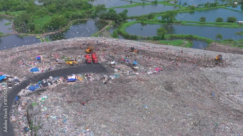  Aerial footage of a landfill in Medan, showcasing heavy machinery managing and organizing waste efficiently