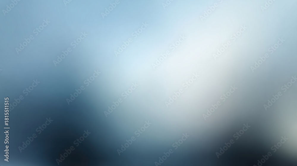 Fototapeta premium A soft, blurred image featuring shades of blue and white, creating a tranquil and abstract atmosphere.