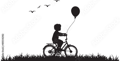 silhouette of a child riding bicycle with balloon