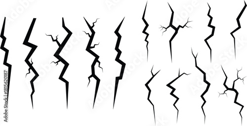 Collection of jagged lightning bolt like cracks depicting sudden vertical damage or electric shock