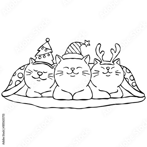 christmas Three cute cats in festive hats snuggled under a blanket.