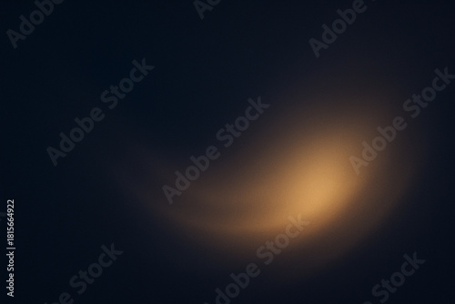 Soft glowing light background in deep navy and warm gold tones, elegant and minimal abstract texture for luxury design