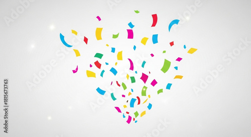 Vibrant colorful confetti explosion falling down against a bright light grey background, perfect for celebrating success and festive events