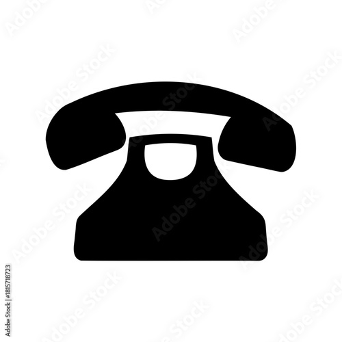 Simple black vector icon of an old fashioned rotary dial telephone