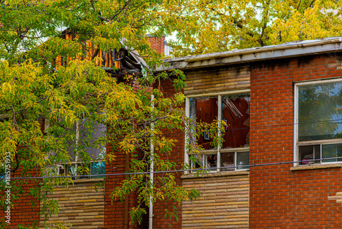 old abandoned house in Downtown Toronto with broken windows