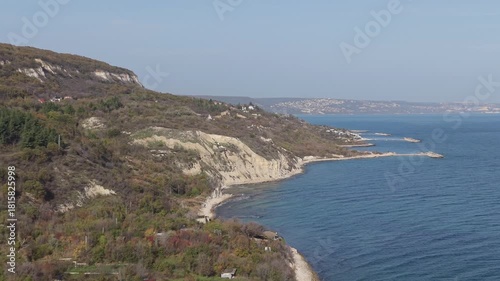 Wallpaper Mural Dramatic aerial view of rocky coastline with steep cliffs, blue sea water, rugged terrain, natural shoreline curves, and expansive coastal landscape Torontodigital.ca