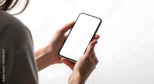 Woman Holding Vertical Smartphone with Blank White Screen for Mobile App Mockup