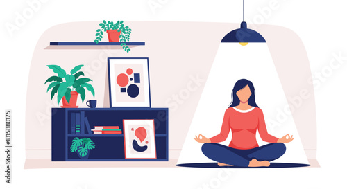 A calm woman meditating in the lotus position in her living room illuminated by a single spotlight finding inner peace.