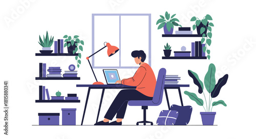 A young man working or studying on a laptop at his desk in a modern and comfortable home office with many plants.