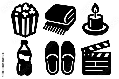 Movie Night Essentials. Movie Comfort silhouette icon set : popcorn bag, soft blanket, candlelight, soda bottle, slippers, movie clapper
