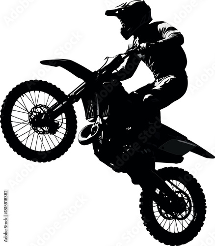 Motocross rider silhouette performing a wheelie on a dirt bike, isolated on