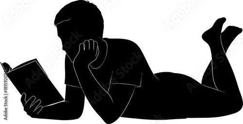 Silhouette of a person lying on their stomach and reading a book, isolated on