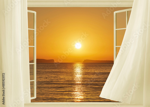 Open window to a seascape at dawn