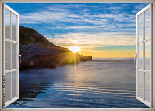 Open window to a seascape at dawn