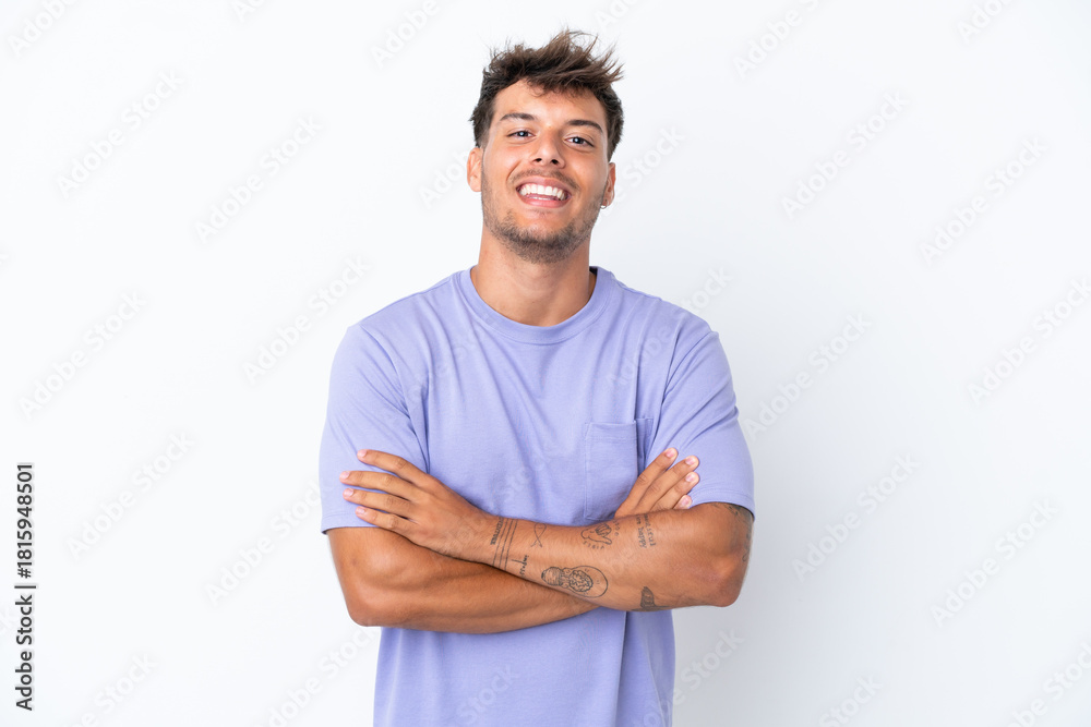 Obraz premium Young caucasian handsome man isolated on white background keeping the arms crossed in frontal position