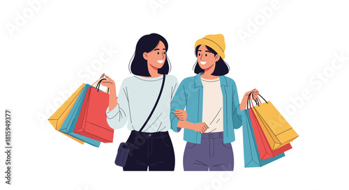 Two happy young women, best friends, walking arm-in-arm and smiling while carrying multiple colorful shopping bags together.