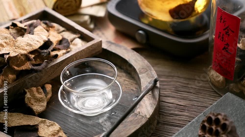 Traditional Chinese Tea Ceremony with Chenpi Citrus Peel and Glass Cup on Wooden Table