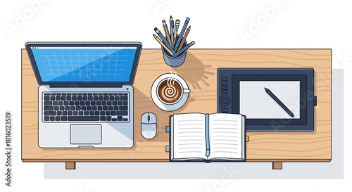 Graphic designer's workspace featuring laptop, pen tablet, notebook and a cup of coffee creating