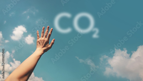 Hand reaching toward the sky with the CO2 symbol, Environmental awareness