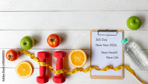 2026 NEW HEALTH AND NEW LIFE.  New year for New Changes Healthy.  Fresh vegetable fruits and healthy food for sport equipment for women diet slimming weight loss on white wood