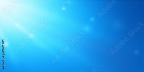 Bright blue sky and sunlight rays shine down through the clear water of the deep ocean, creating a vibrant underwater background with sea bubbles in motion