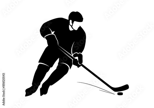 Silhouette of ice hockey player in action with puck