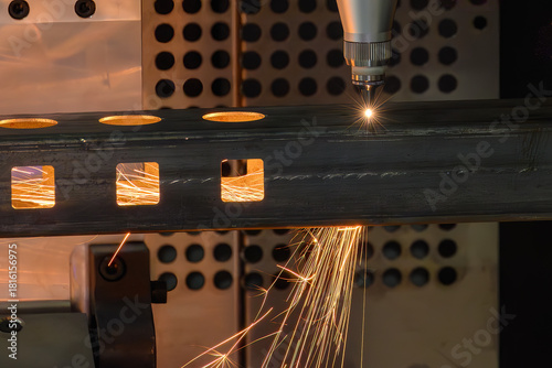 Close up scene the fiber laser cutting machine cut  the square stainless steel tube.