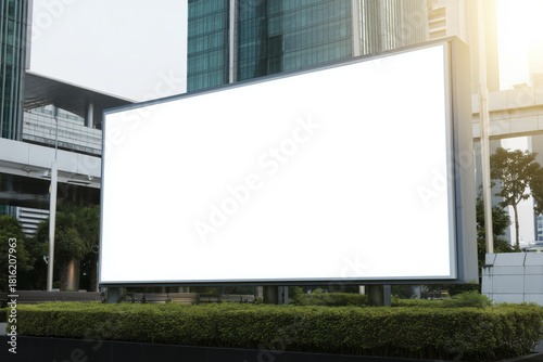 Modern square lightbox billboard in urban landscape during the day
