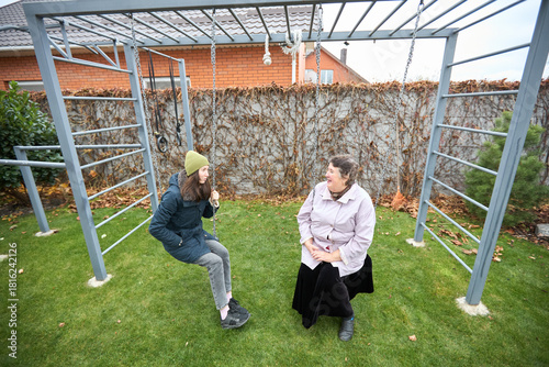 Outdoor conversation: family connection in backyard garden setting