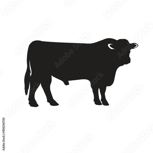 A strong black bull silhouette stands tall, isolated on, embodying power and resilience in its simple yet striking form
