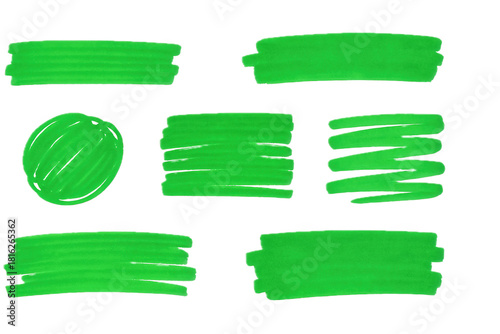 Collection of various green highlighter marker strokes, isolated over black.