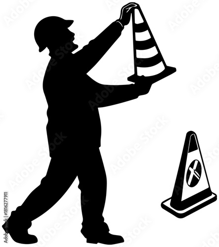 Silhouette of Construction Worker Placing Traffic Cone