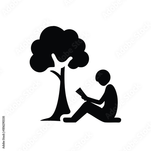Silhouette of a person reading under a tree
