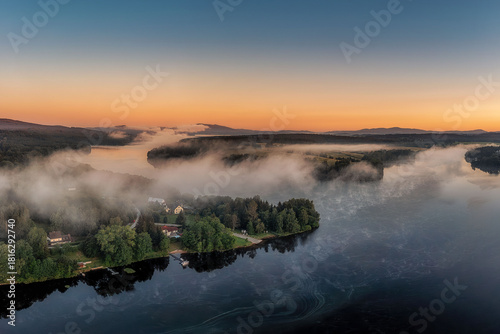 Frymburk on the shore of the Lipno dam at sunset from above