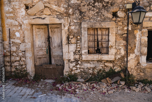 an old window in a stone wall seen from the outside of the building