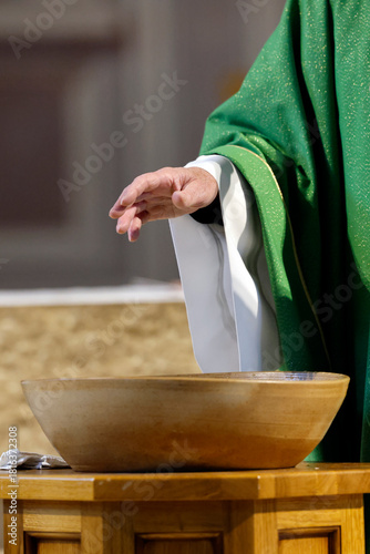 Saint Agatha Church.Baptism ceremony.Blessing of the baptismal water. Rumilly. France.