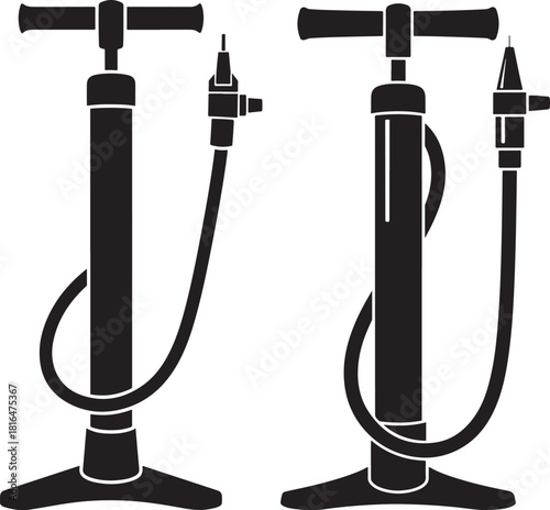 Two black bicycle tire pumps standing side by side silhouette