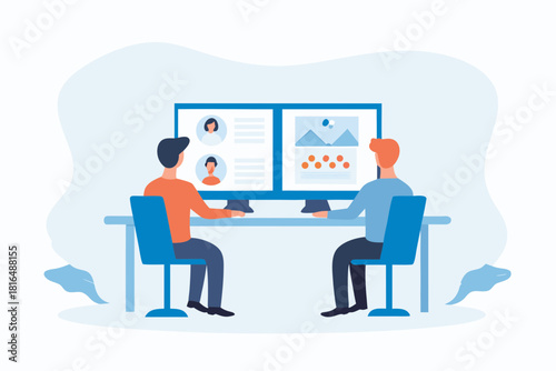 Two people working together on a large computer screen