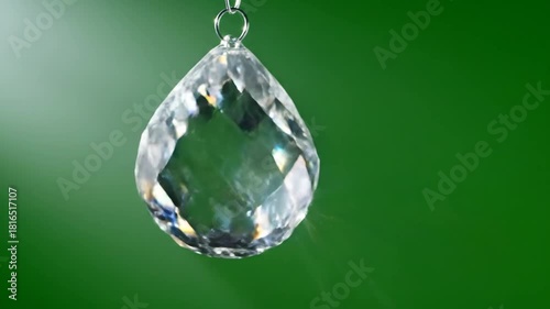 Crystal Pendant on Green Background - Sparkling Light and Reflection.