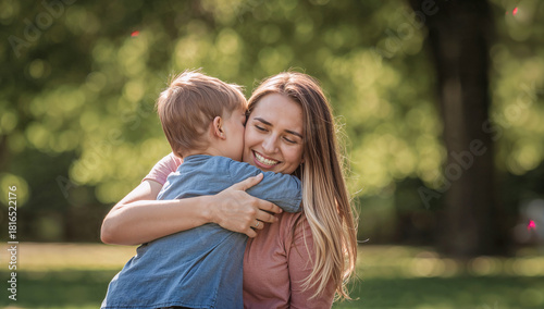 Happy Mother Hugging Her Child Outdoors, Showing Love, Warmth and Emotional Family Connection