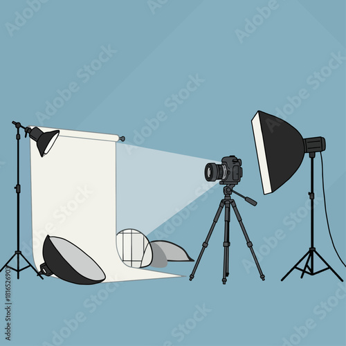 Professional photography studio setup with camera, tripod, backdrop, and lighting equipment.