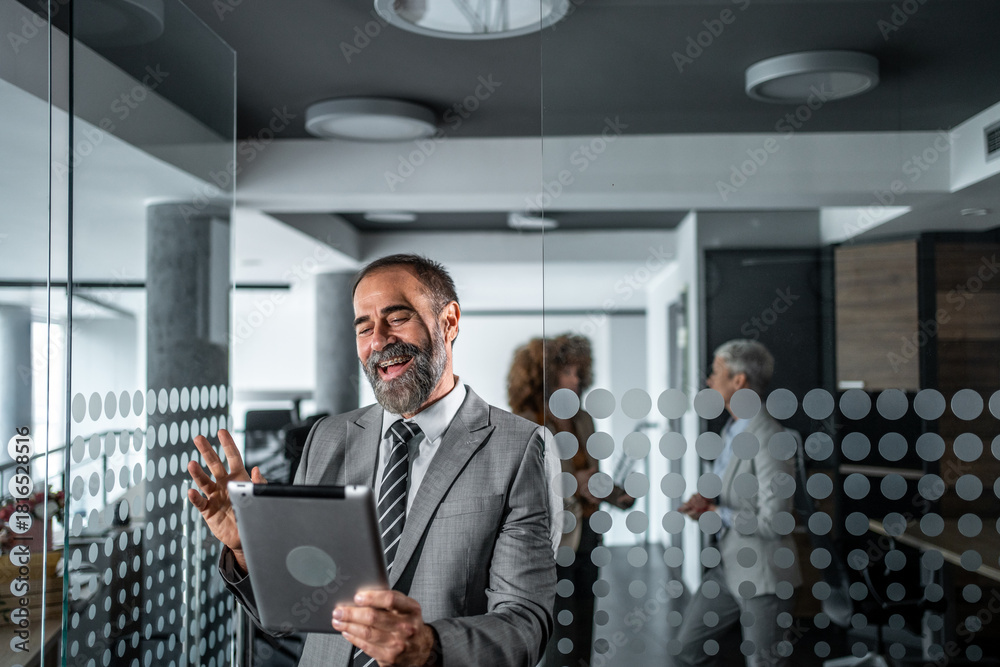 custom made wallpaper toronto digitalMature businessman having video call on tablet in office